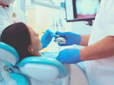 Dentist treats patient