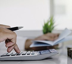 Man using a calculator