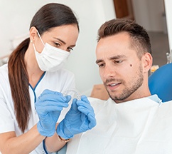 Reveal patient in Spring Hill talking to dentist