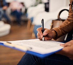 Reveal patient in Spring Hill filling out forms